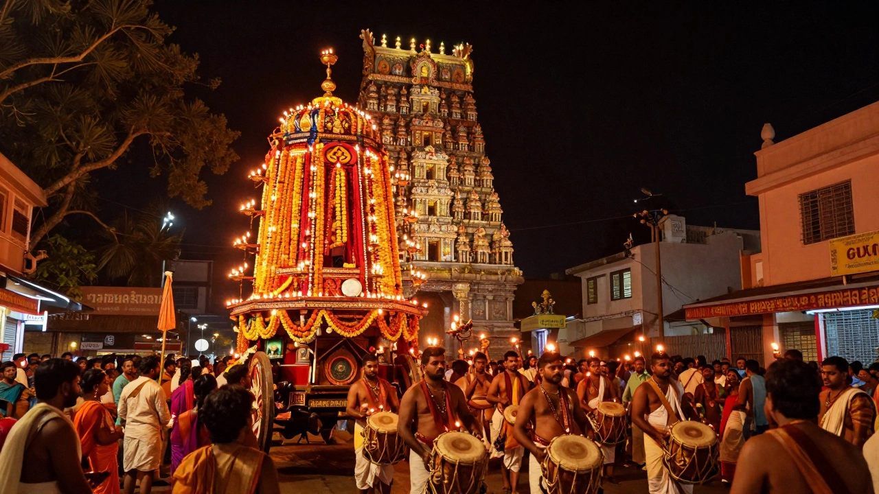 A grand temple chariot procession at night, lit by lamps and surrounded by devoted crowds in Madurai.