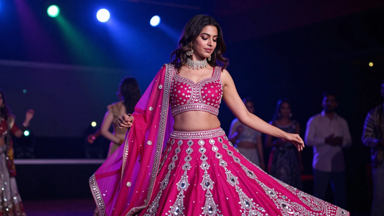 Woman dancing in a sparkling magenta Lehenga Choli with mirror work at a Sangeet party