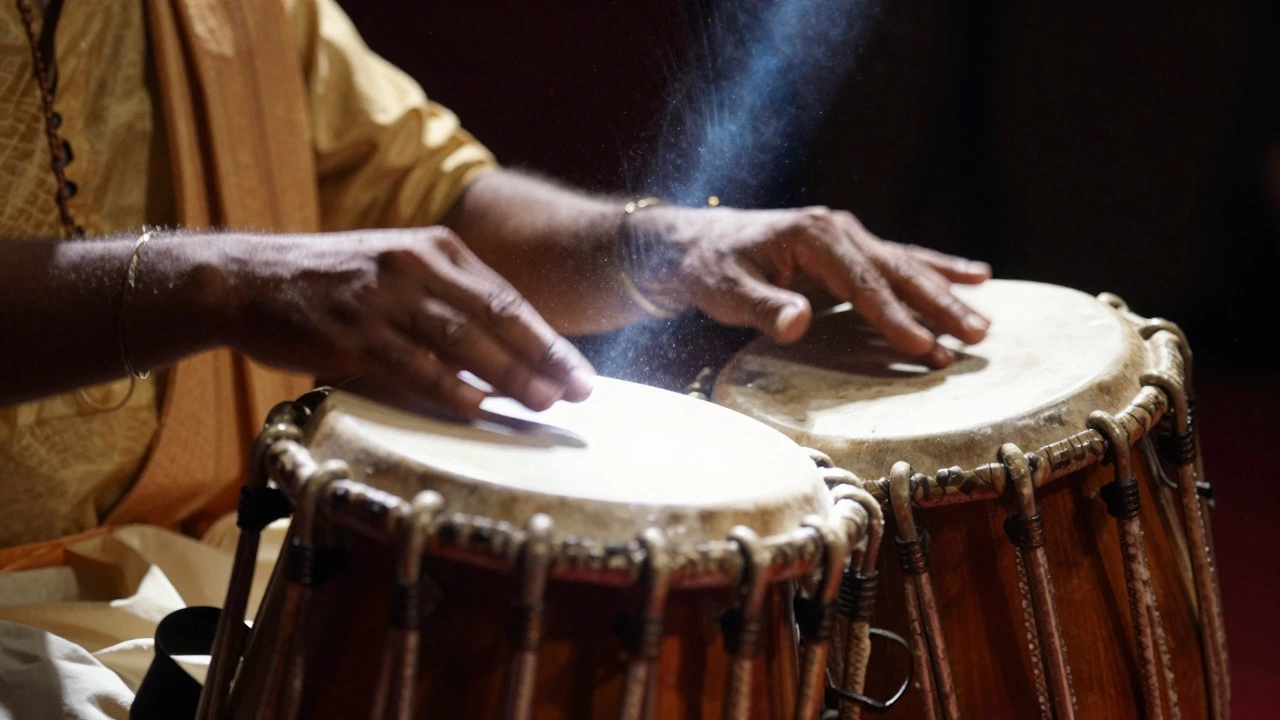 Close-up of hands playing the Mridangam drum with rapid rhythmic precision.